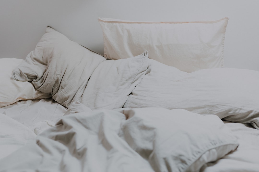 White bed pillows on freshly made bed