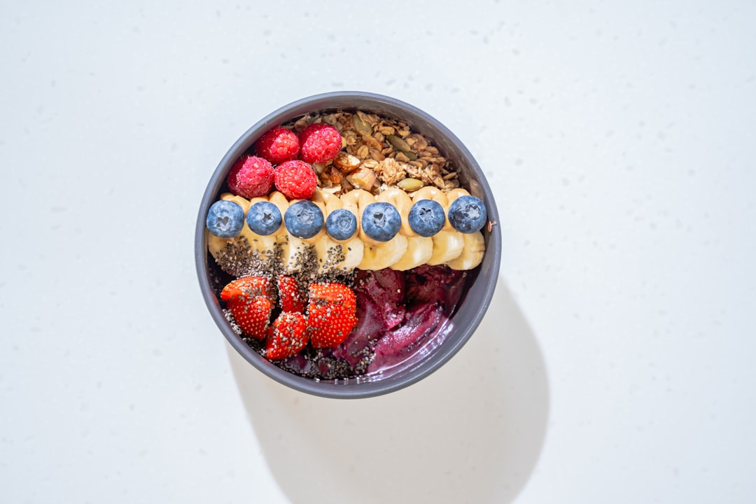 Colorful smoothie bowl topped with fresh berries