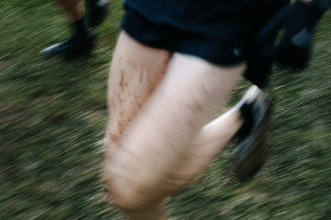 Close-up of a runner's calf muscle where a muscle oxygen sensor is worn during training