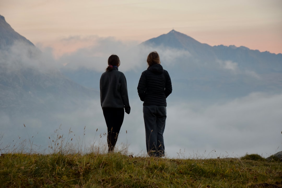 Couple taking in a misty mountain view together on a hike