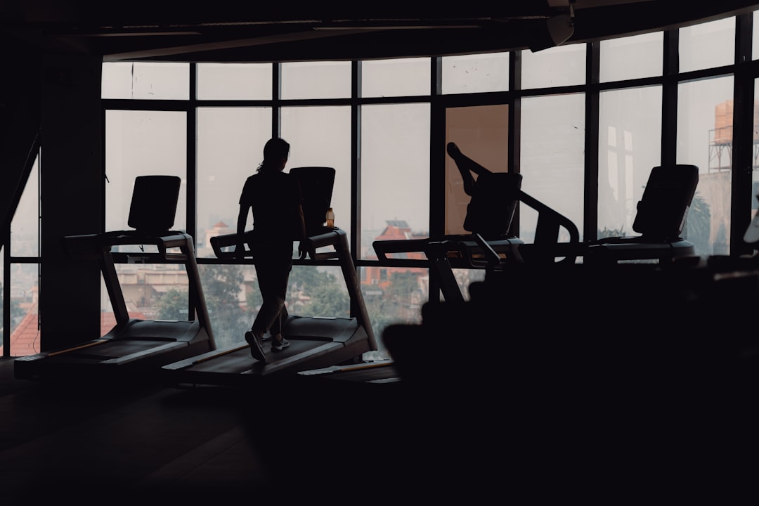 Person walking on a treadmill in a home gym