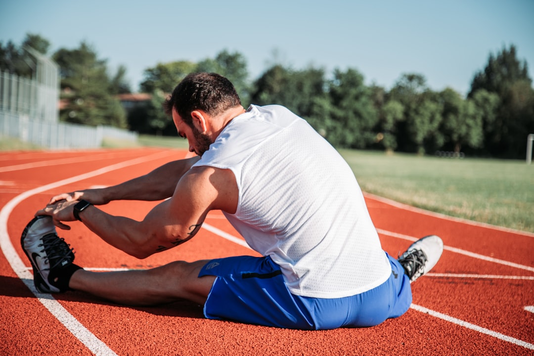 Athlete stretching during cool down and recovery