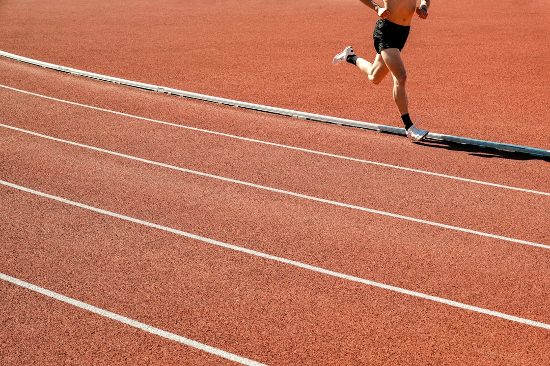 Runner sprinting on a track during speed interval training
