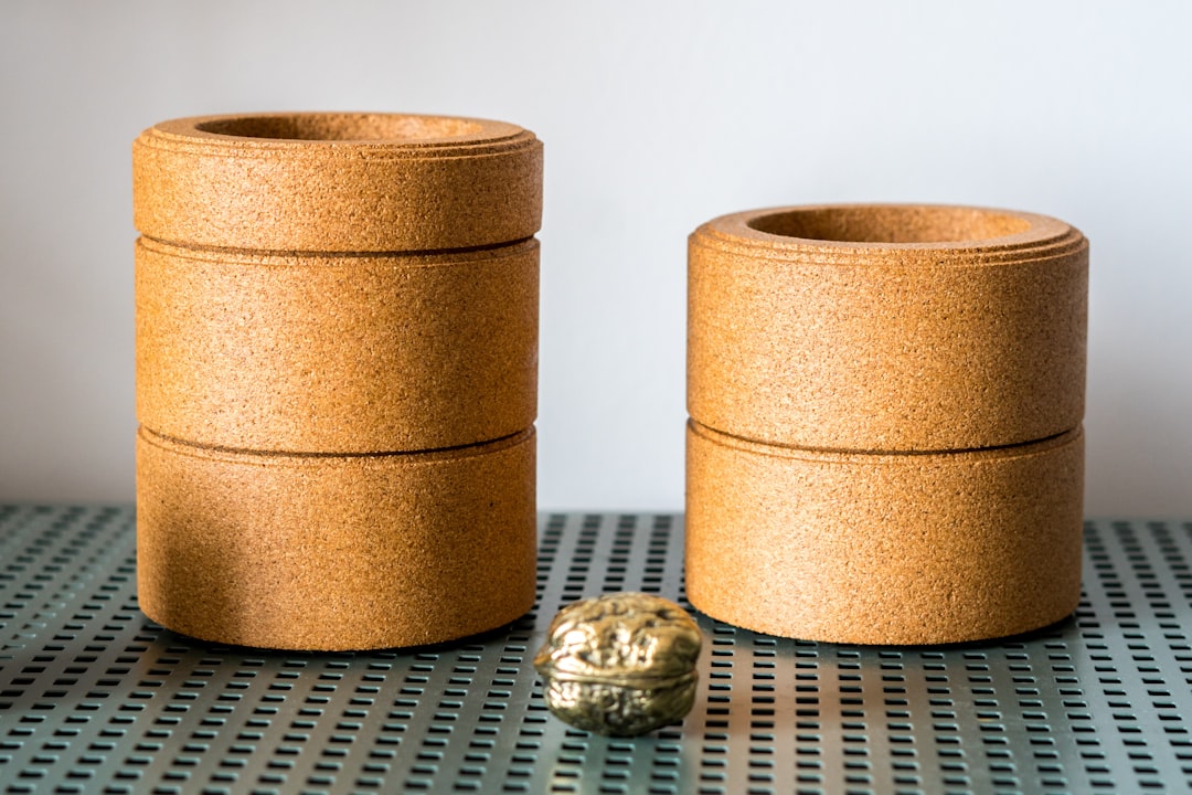 Stacked cork yoga blocks on a metal shelf