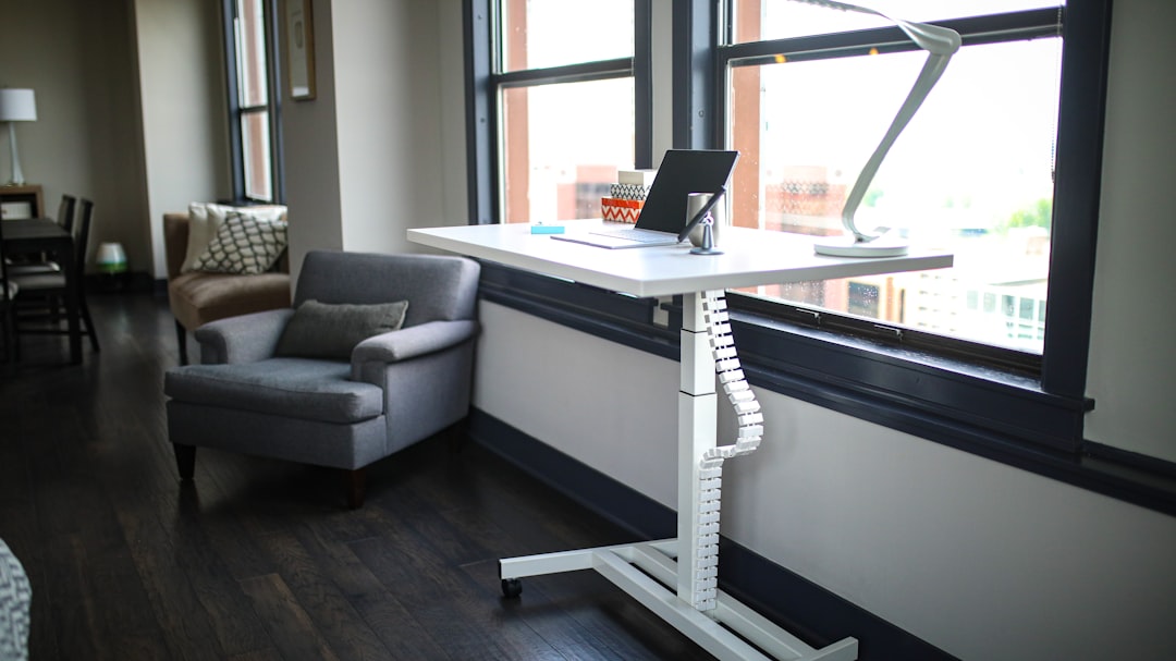Bright home workspace with a standing desk set up for daily routines