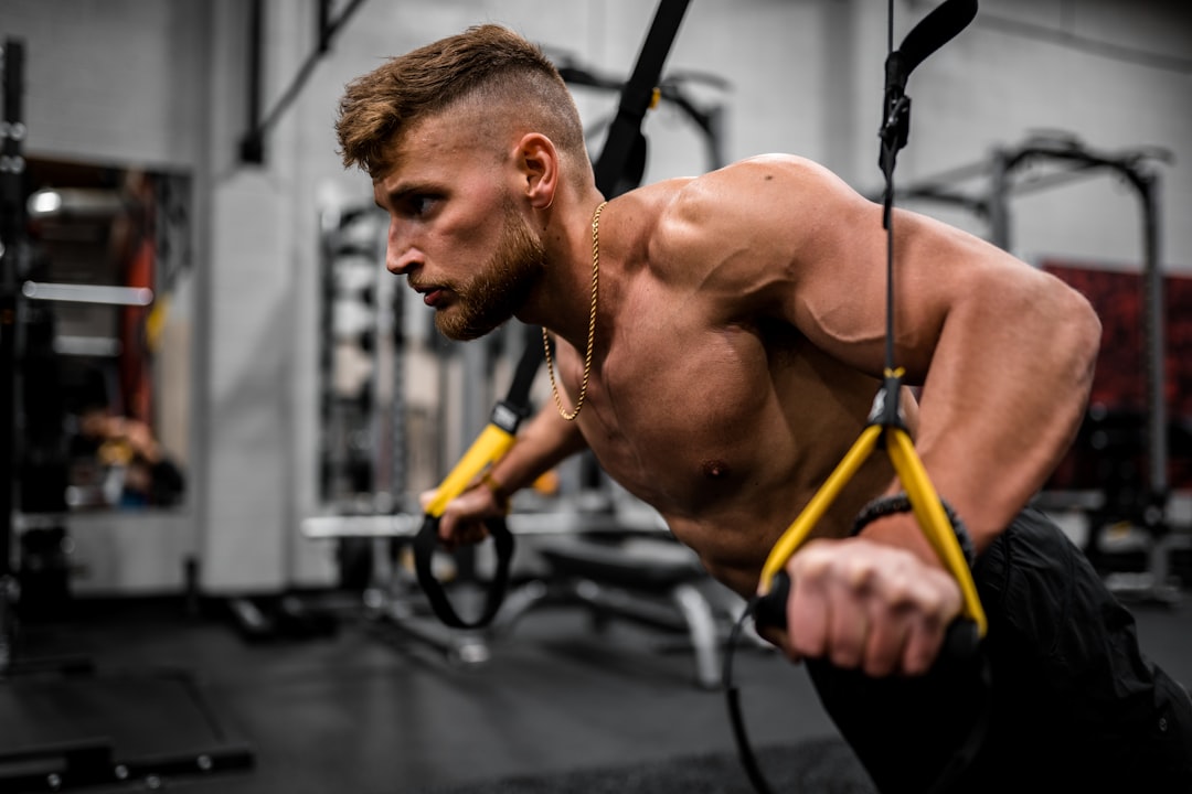 Cable crossover exercise in fitness setting