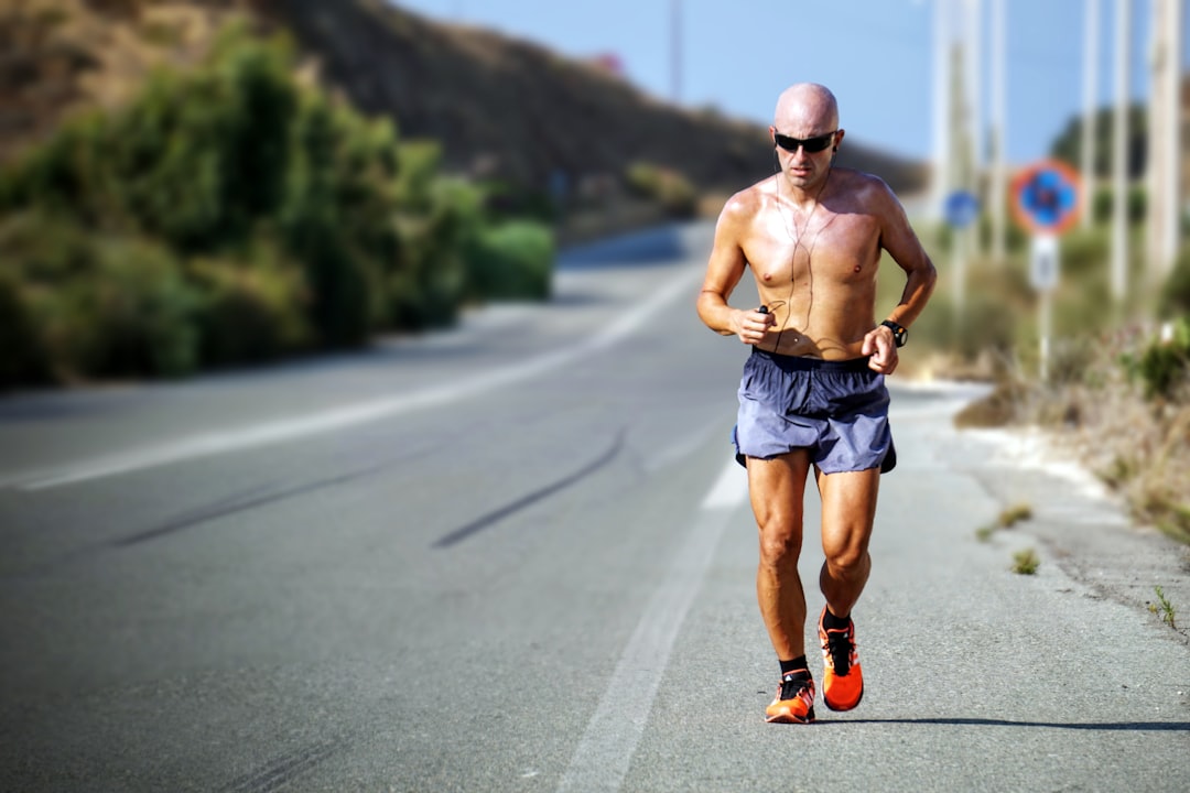 Runner pushing through a hot summer training session