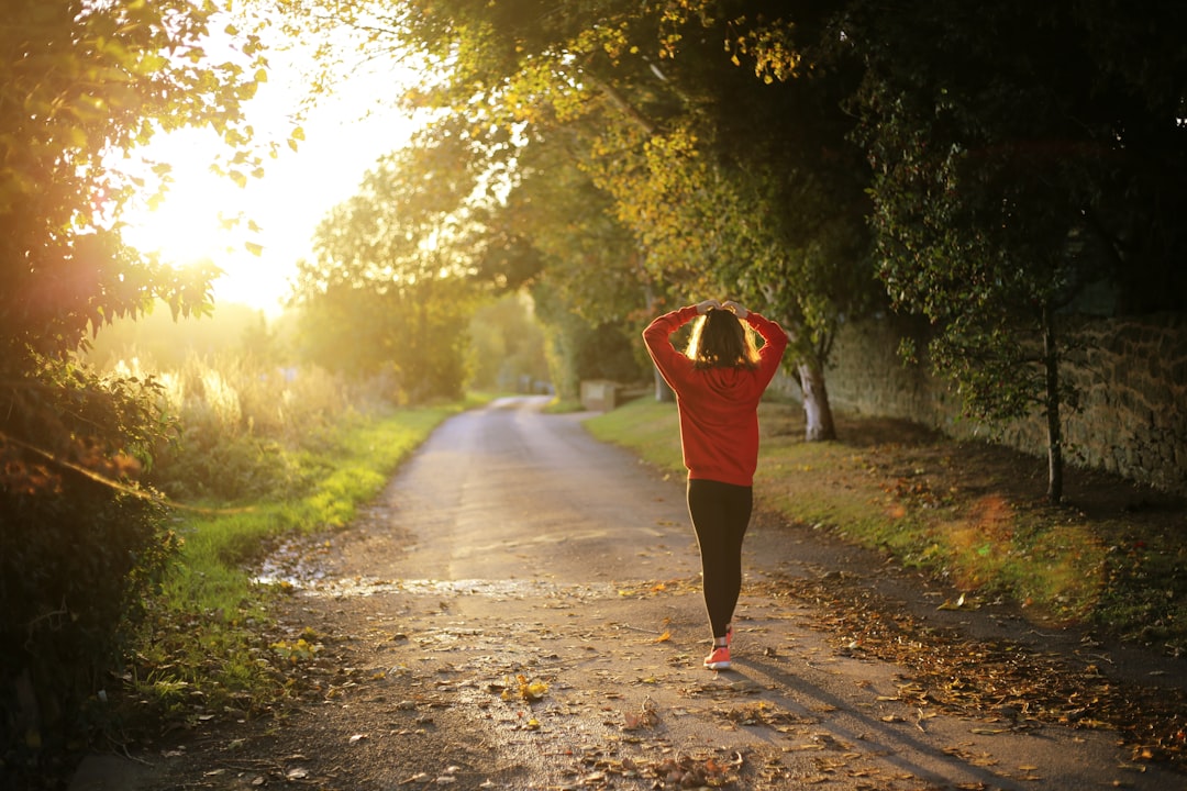 Woman walking outdoors in the morning sunlight