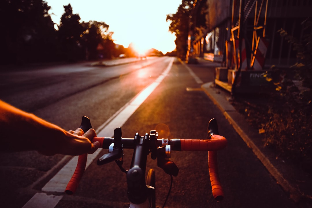 Cyclist's bike computer mounted on the handlebars showing ride data