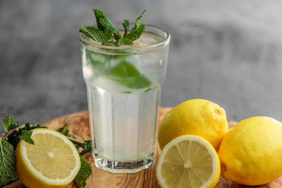 Iced citrus drink with lemon slices and mint