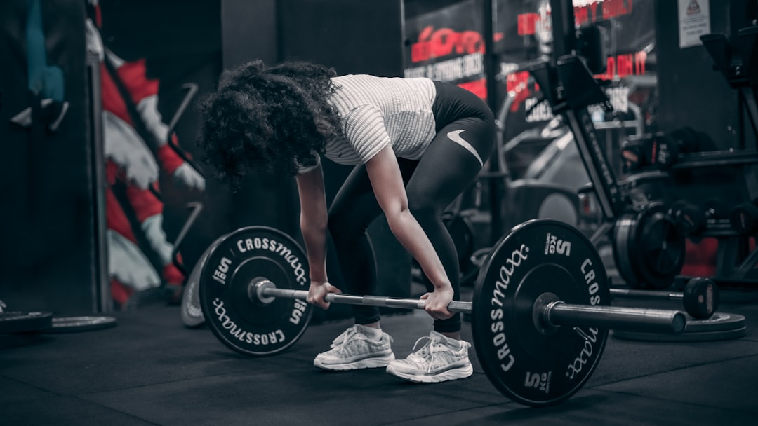 Athlete training with weights in gym