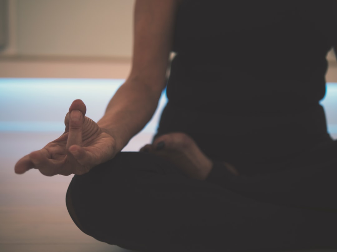Person practicing calm nasal breathing during meditation