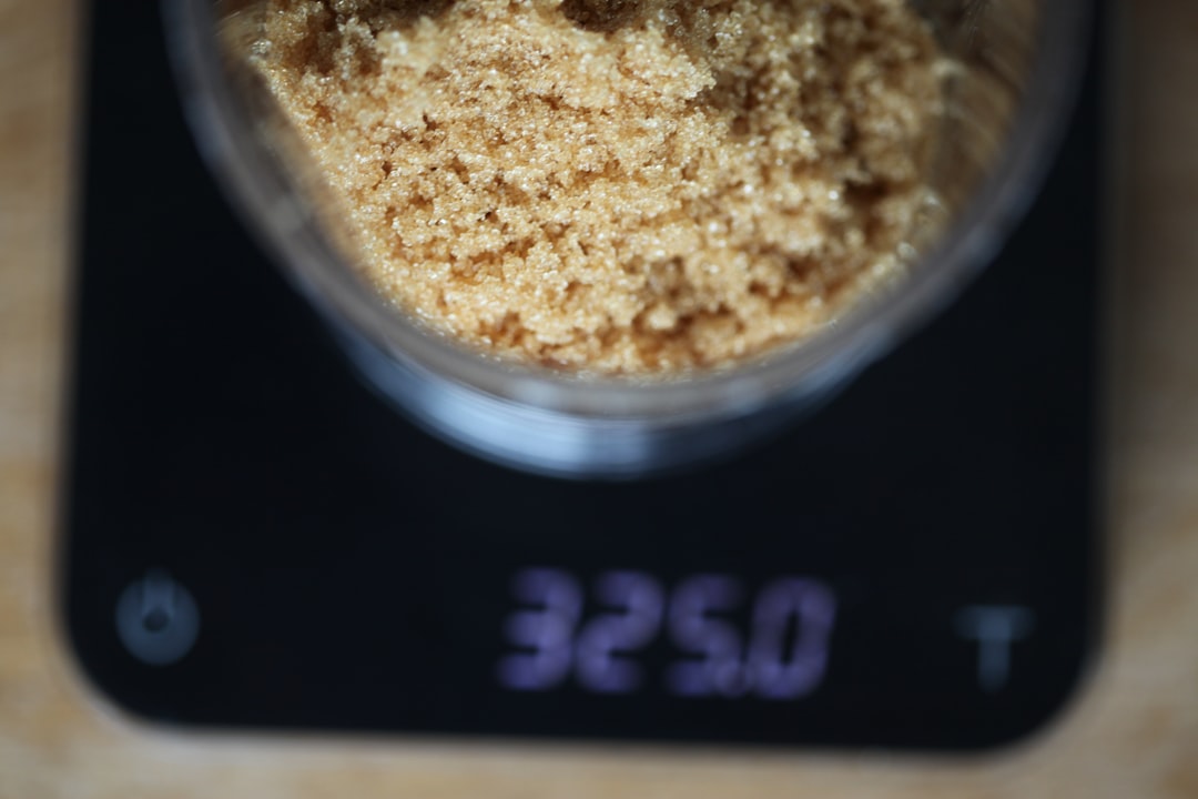 Measuring supplement powder on a kitchen scale