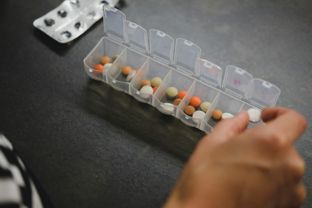 Weekly pill organizer filled with supplements