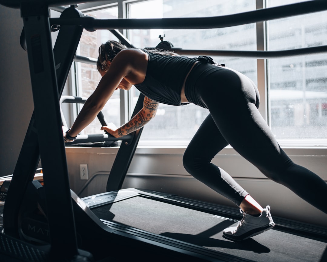 Athlete training with equipment in a bright gym