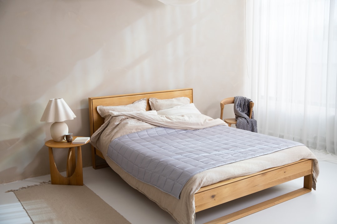 Lightweight cooling blanket neatly made on a bed
