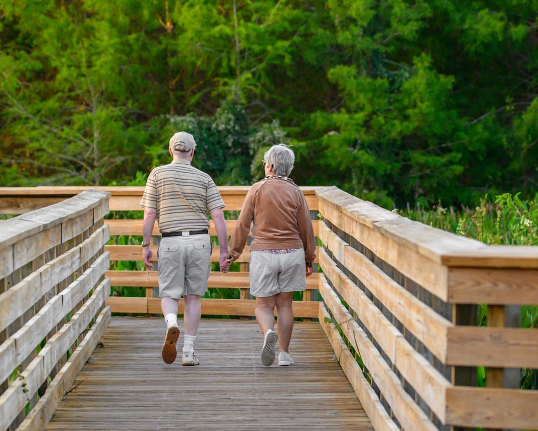 Two older adults out walking together in sneakers