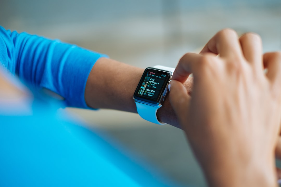 Athlete checking heart rate data on a smartwatch mid-workout
