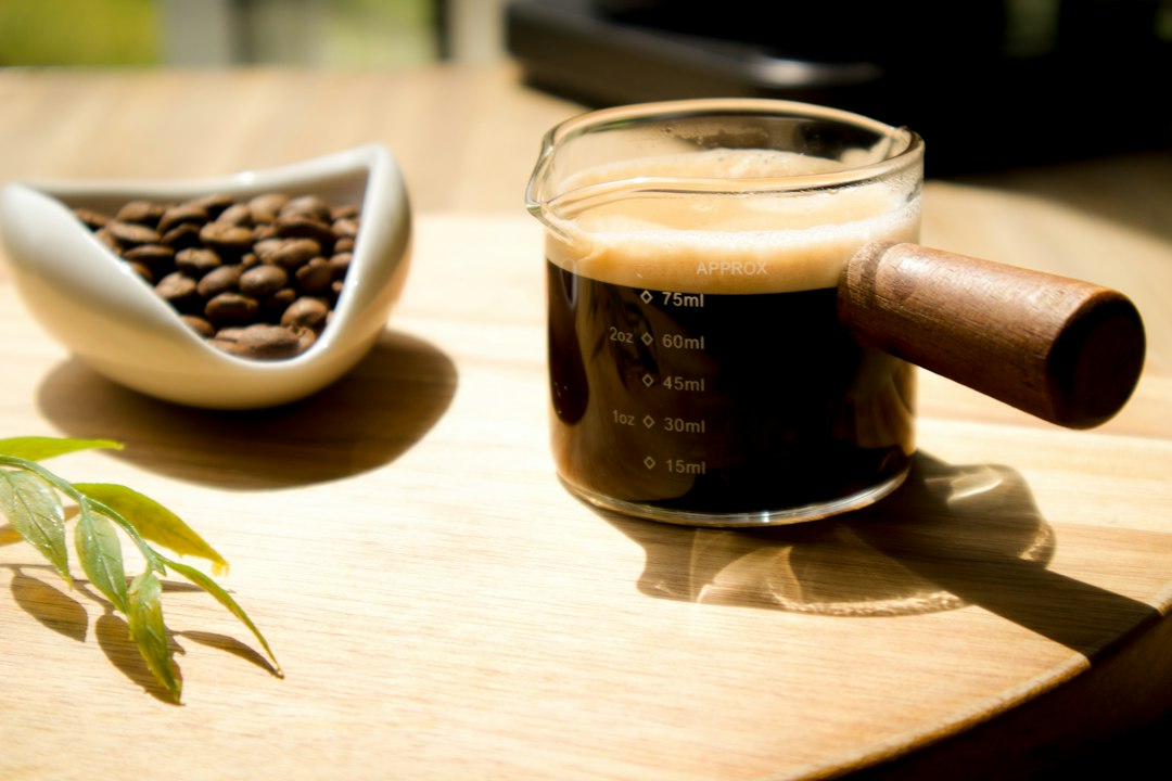 Morning coffee in sunlight on a wooden table