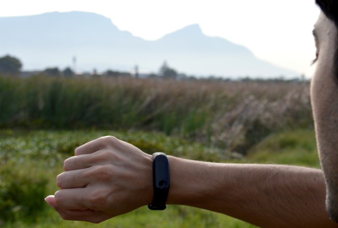 Wearable fitness tracker on a wrist during an outdoor workout