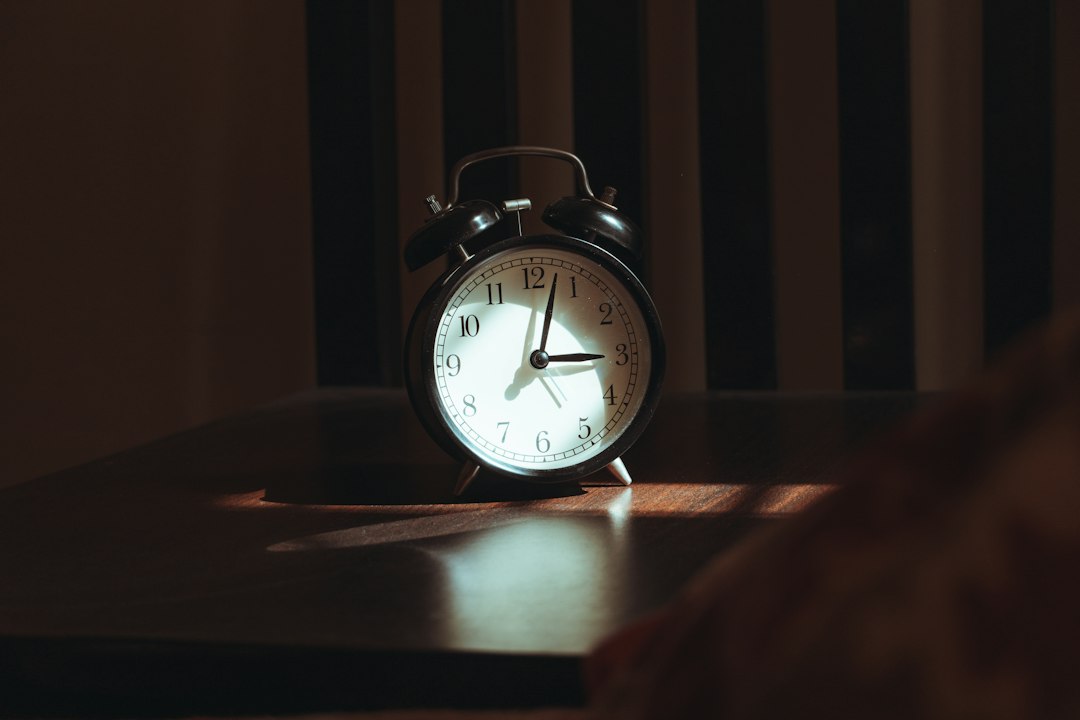 Alarm clock on a nightstand in soft morning light