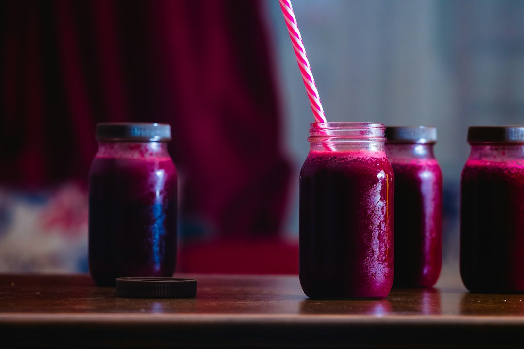 Jars of deep red fresh beet juice ready to drink