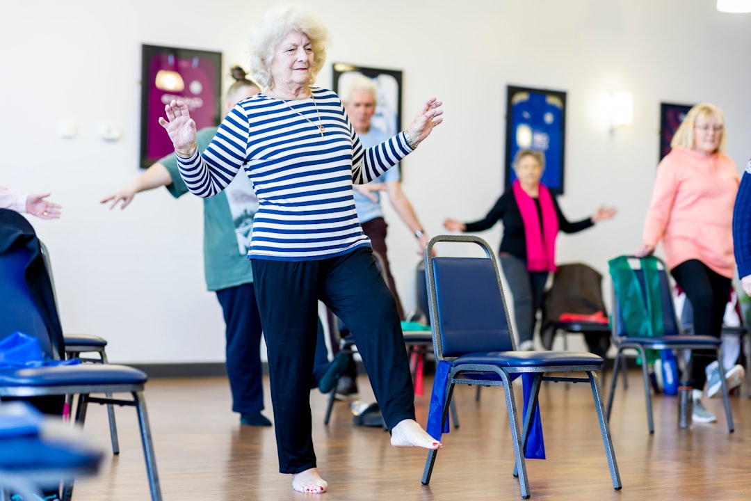 Older adults practicing standing balance exercises together