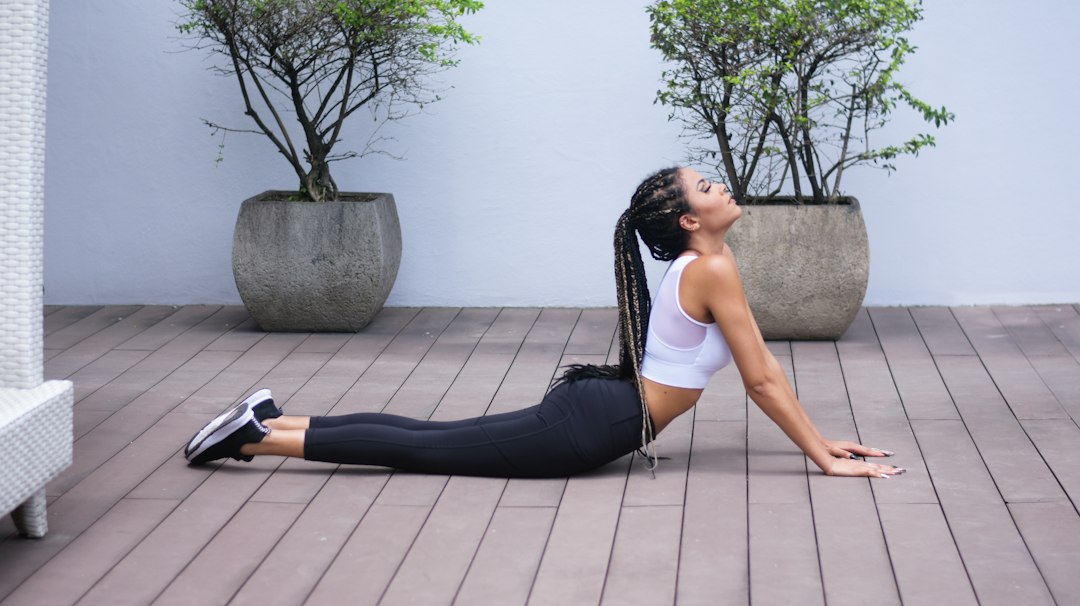 Man performing a back extension stretch on the floor