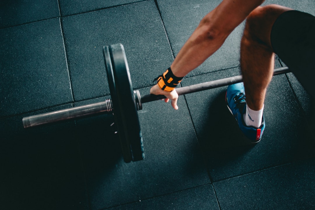 A hand gripping a barbell, the training the data ultimately serves