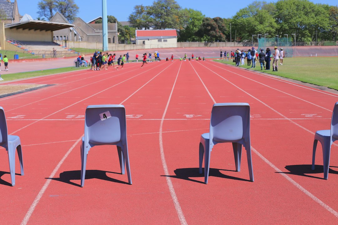 Athletes on a running track preparing to train