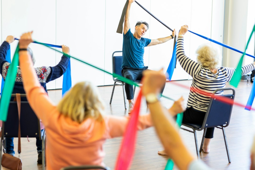 Older adult stretching his back gently at home
