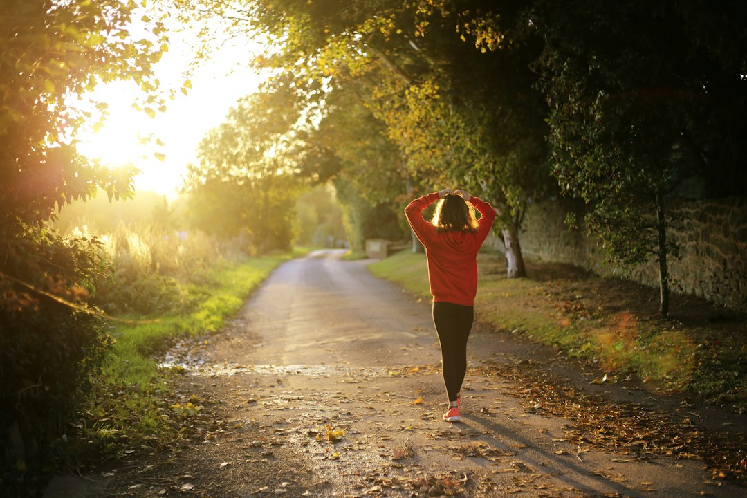Woman runner on a crisp autumn path