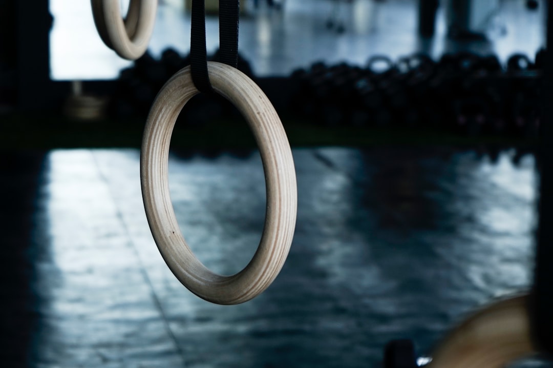 Wooden gymnastic rings hanging in a gym