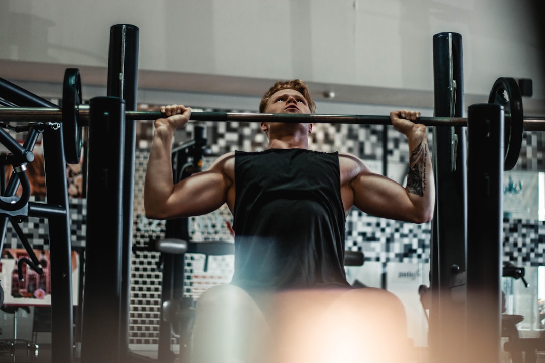 Lifter performing a bench press on a weight bench