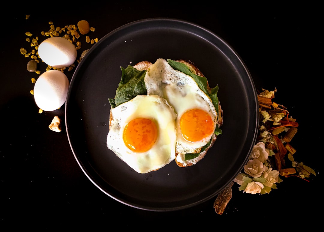 Fried eggs with bright yolks, a natural food source of vitamin D at breakfast