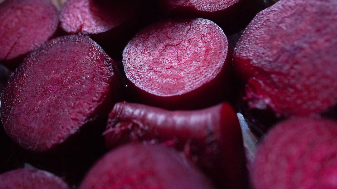 Sliced raw red beets on a kitchen surface