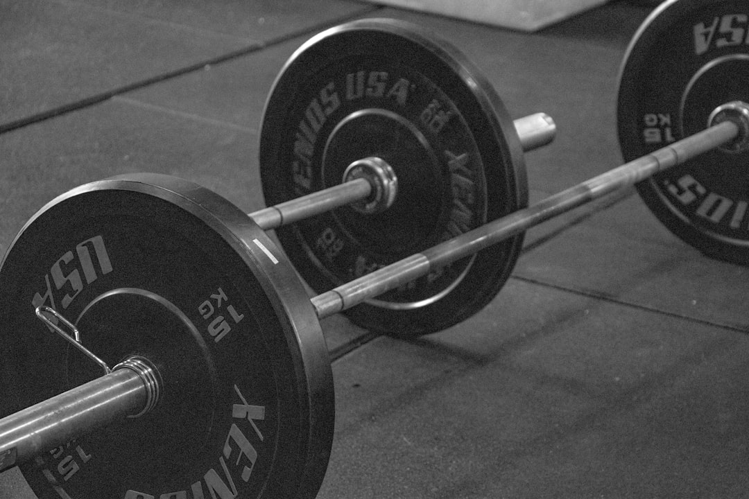 Close-up of barbell loaded with weight plates