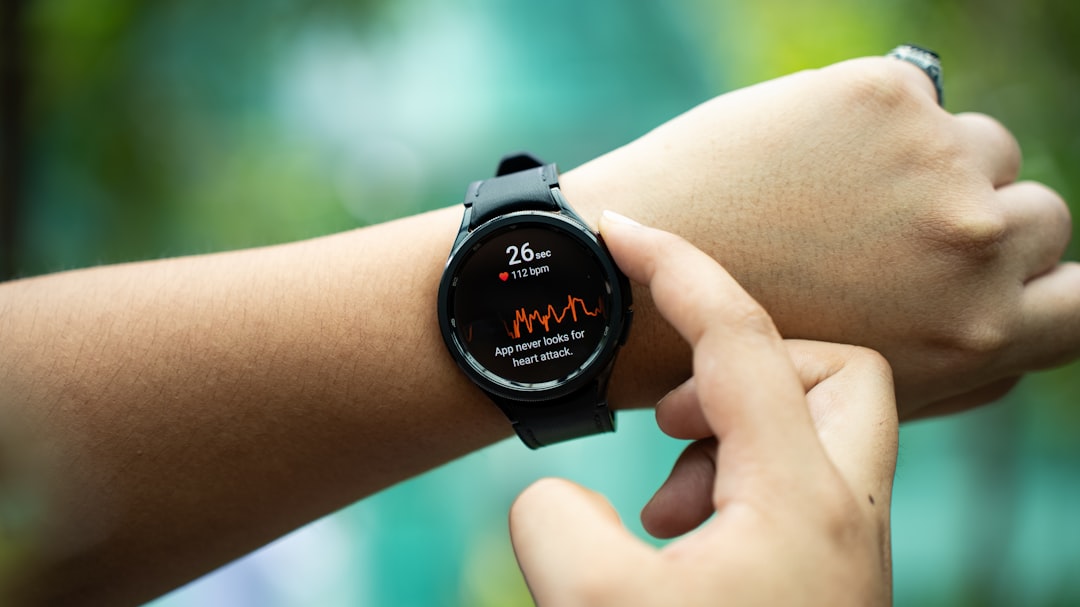 Smartwatch displaying heart rate data on a wrist