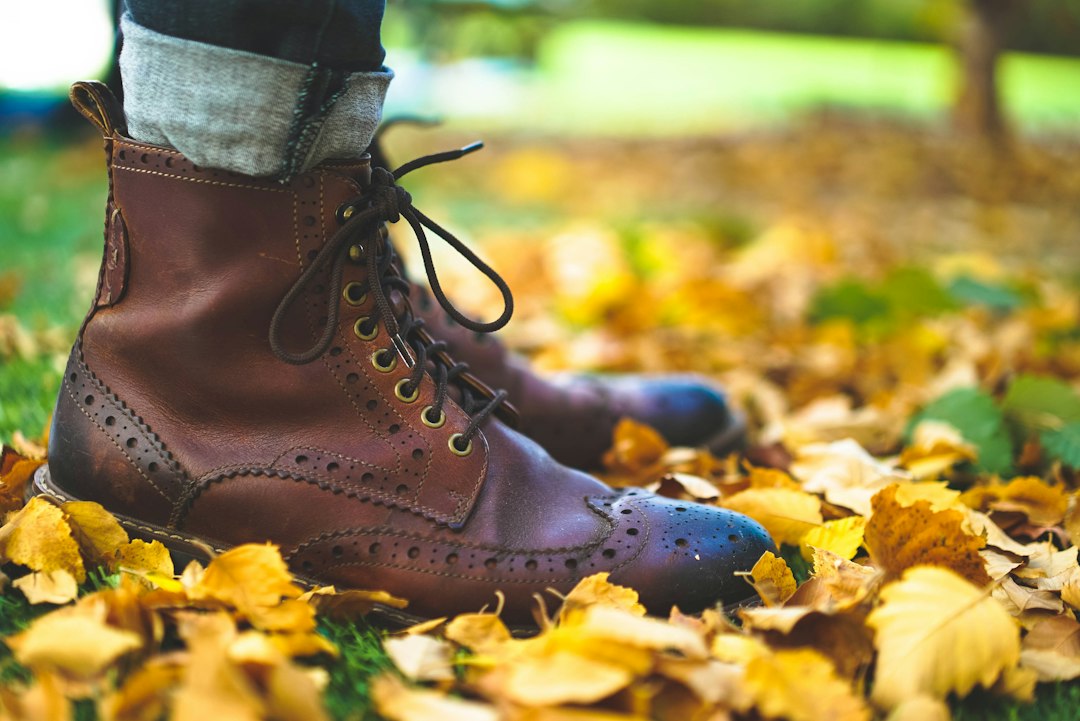 Walking shoes on a carpet of fallen leaves