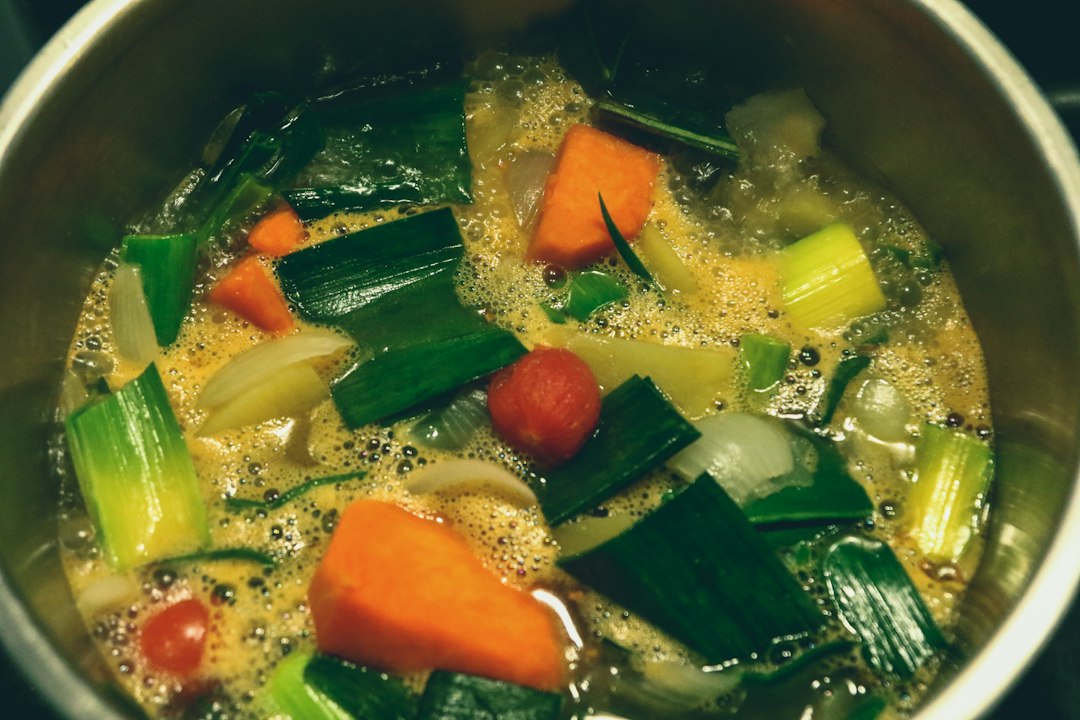 A pot of homemade vegetable soup simmering