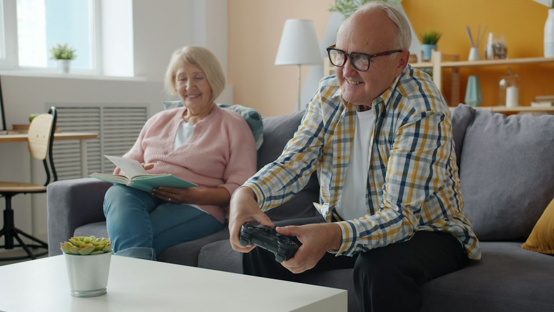 Older couple relaxing together on their couch in the living room