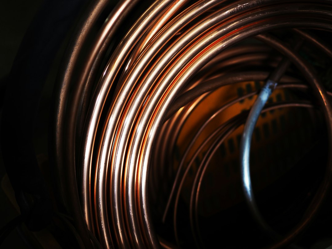 Close view of coiled copper tubing, a visual cousin of the windings inside field-therapy mats