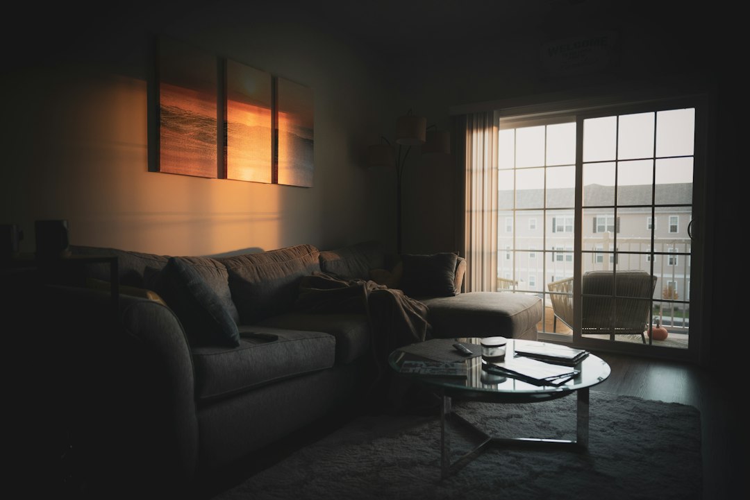 A dim living room in the evening, the kind of corner a recumbent bike has to earn