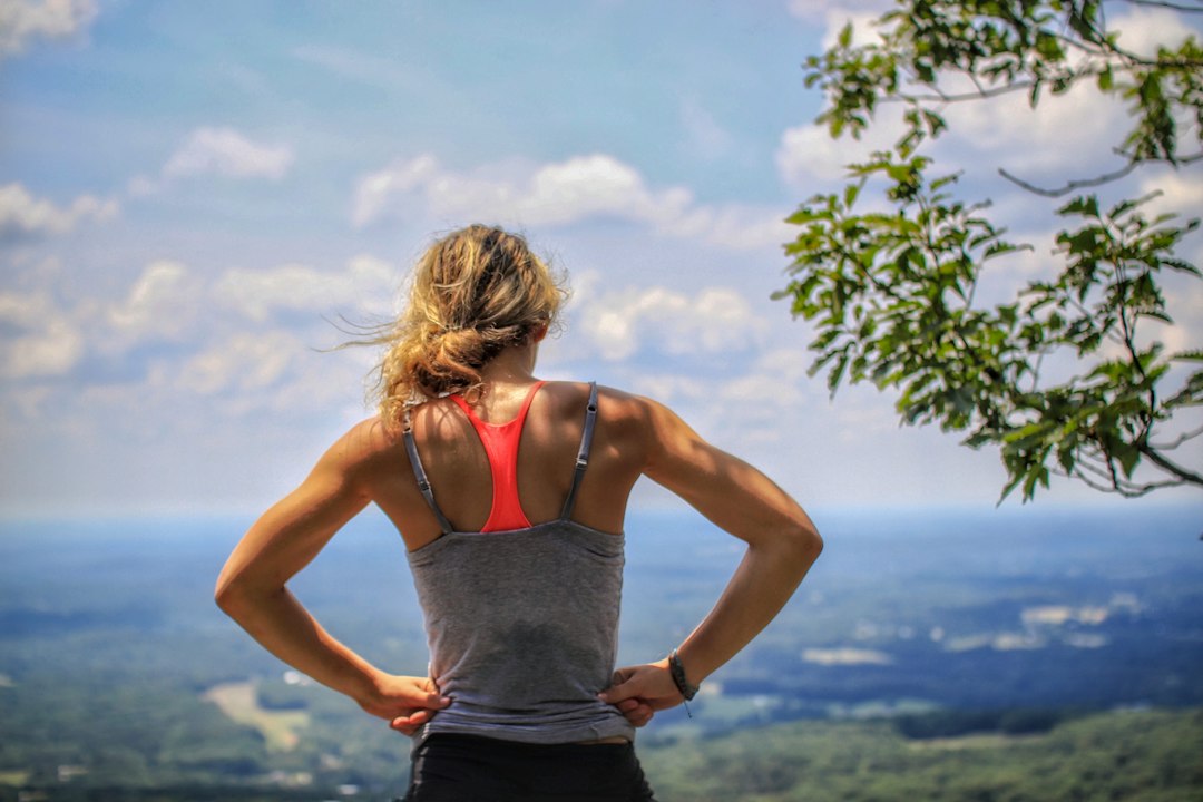 Female runner looking exhausted on an autumn trail