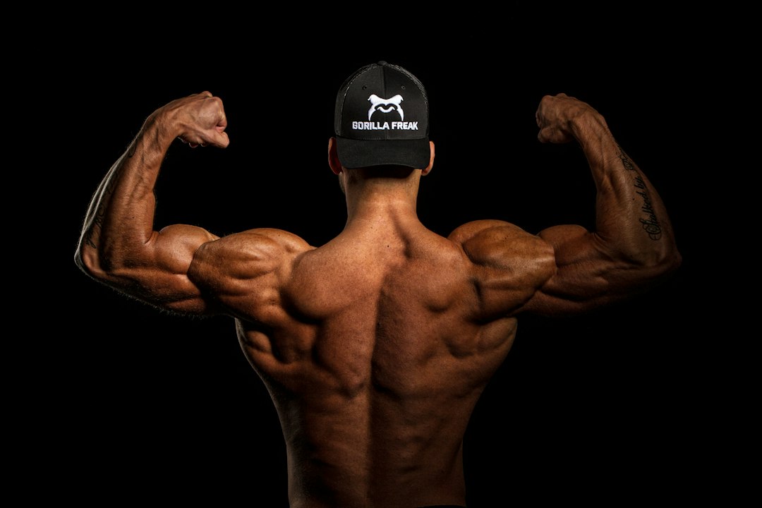 Muscular upper arm and back, showing the bicep area where the band can be worn