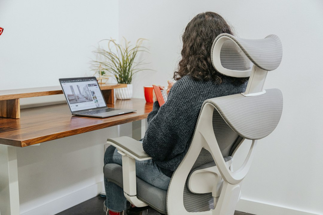 Woman working at a desk in an ergonomic office chair